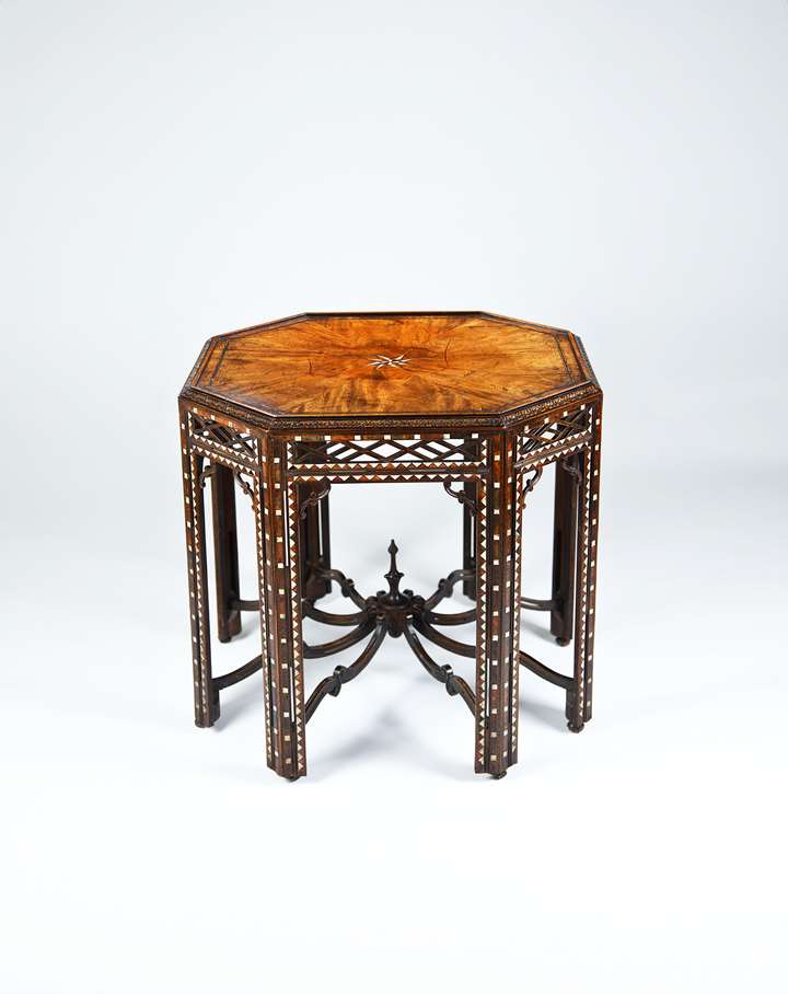 A rare mid 18th century octagonal carved mahogany silver table veneered and inlaid with tortoiseshell and bone